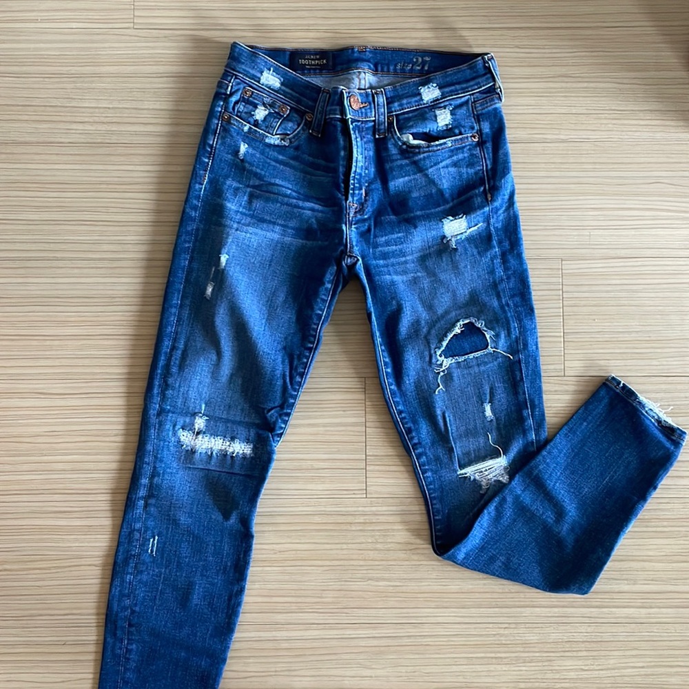 Distressed denim jeans